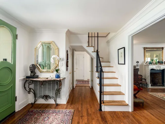 a living room with fireplace furniture and a flat screen tv