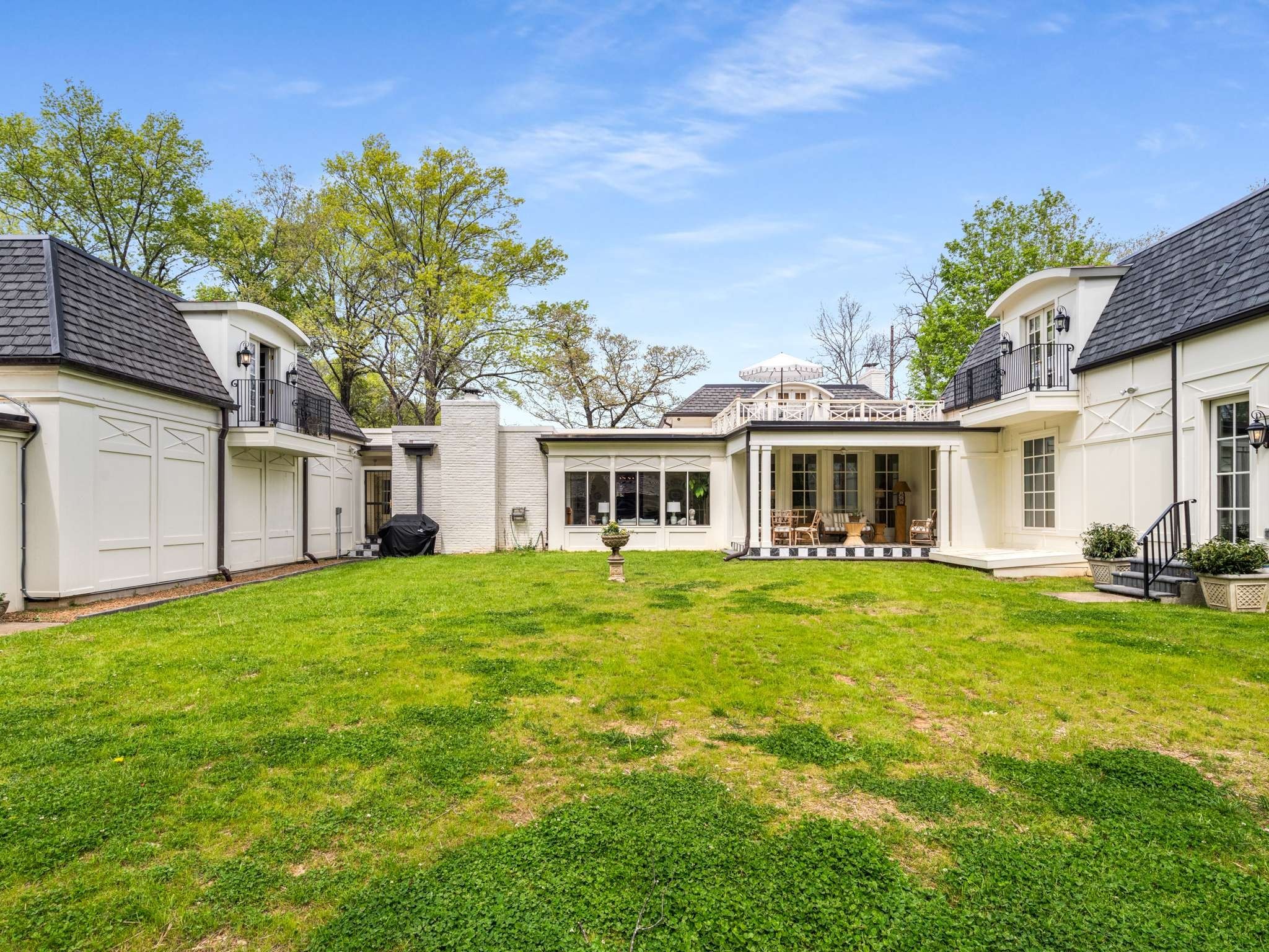 305 Davidson Road Nashville, TN 37205 - Photo 64 of 73 a front view of a house with a garden and porch