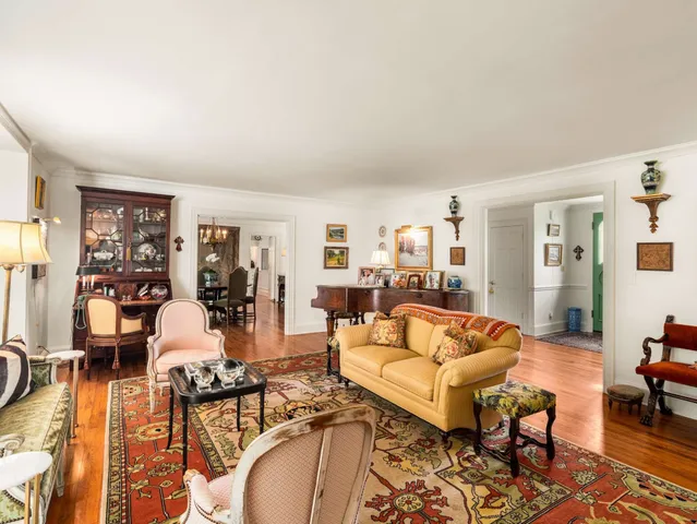 a view of a dining room with furniture wooden floor and chandelier