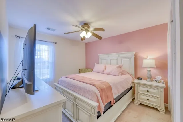 a bedroom with furniture and a chandelier