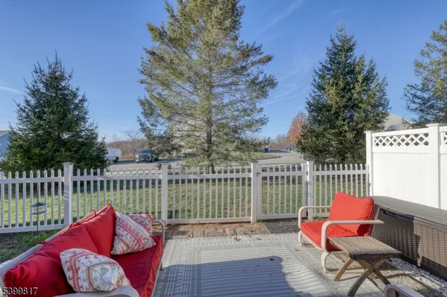 a balcony with furniture and a potted plant