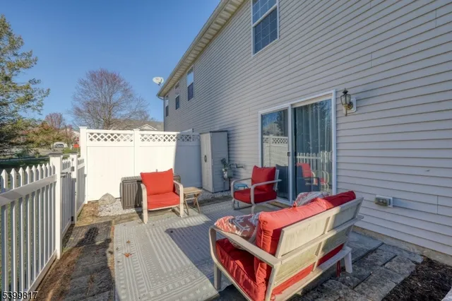 a front view of a house with a garden and porch