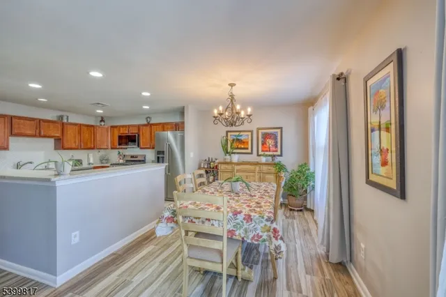 a kitchen with furniture and wooden floor