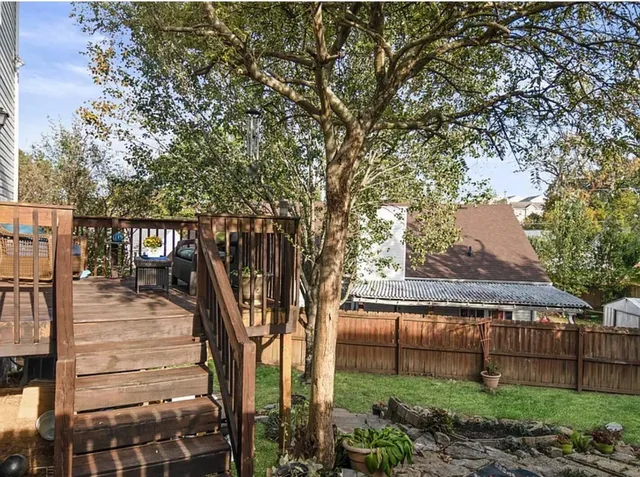 a view of house with a tree in the background