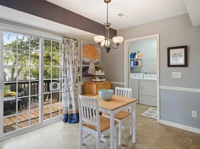 a view of a dining room with furniture window and outside view