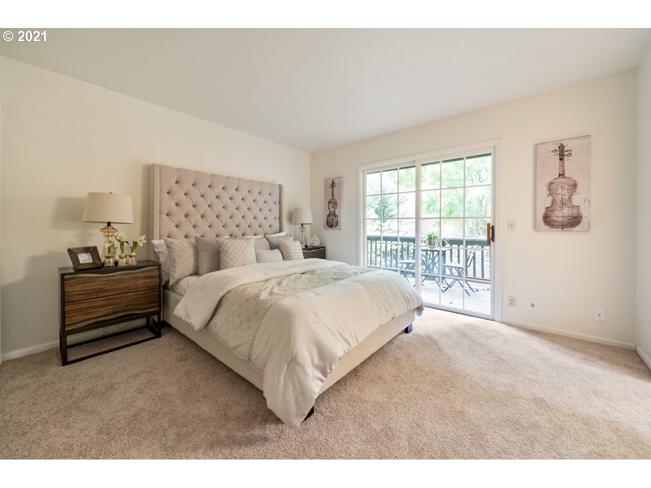 3939 Southwest Altadena Avenue Portland, OR 97239 - Photo 15 of 31 a spacious bedroom with a bed and a window