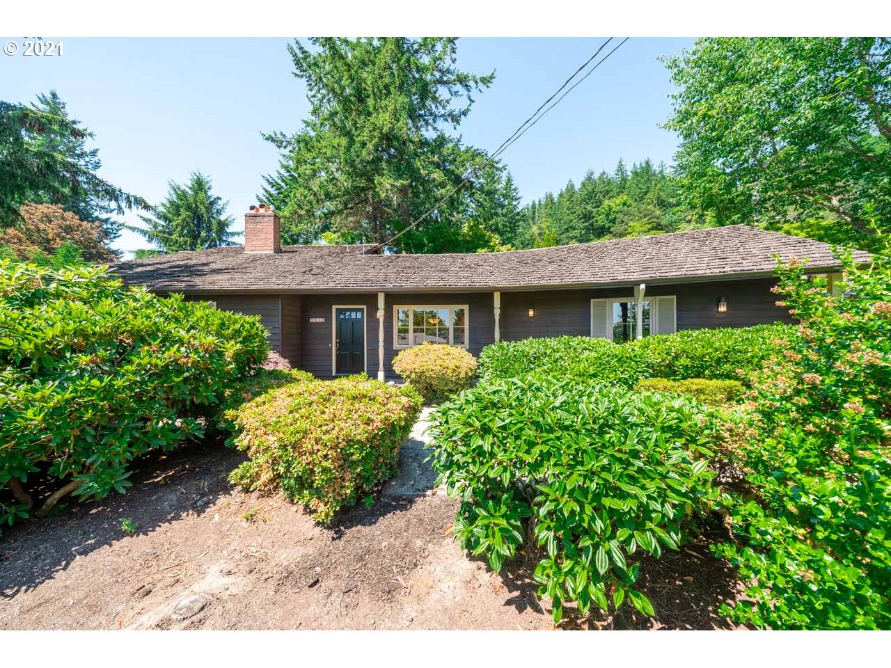3939 Southwest Altadena Avenue Portland, OR 97239 - Photo 2 of 31 a view of a house with a yard and potted plants
