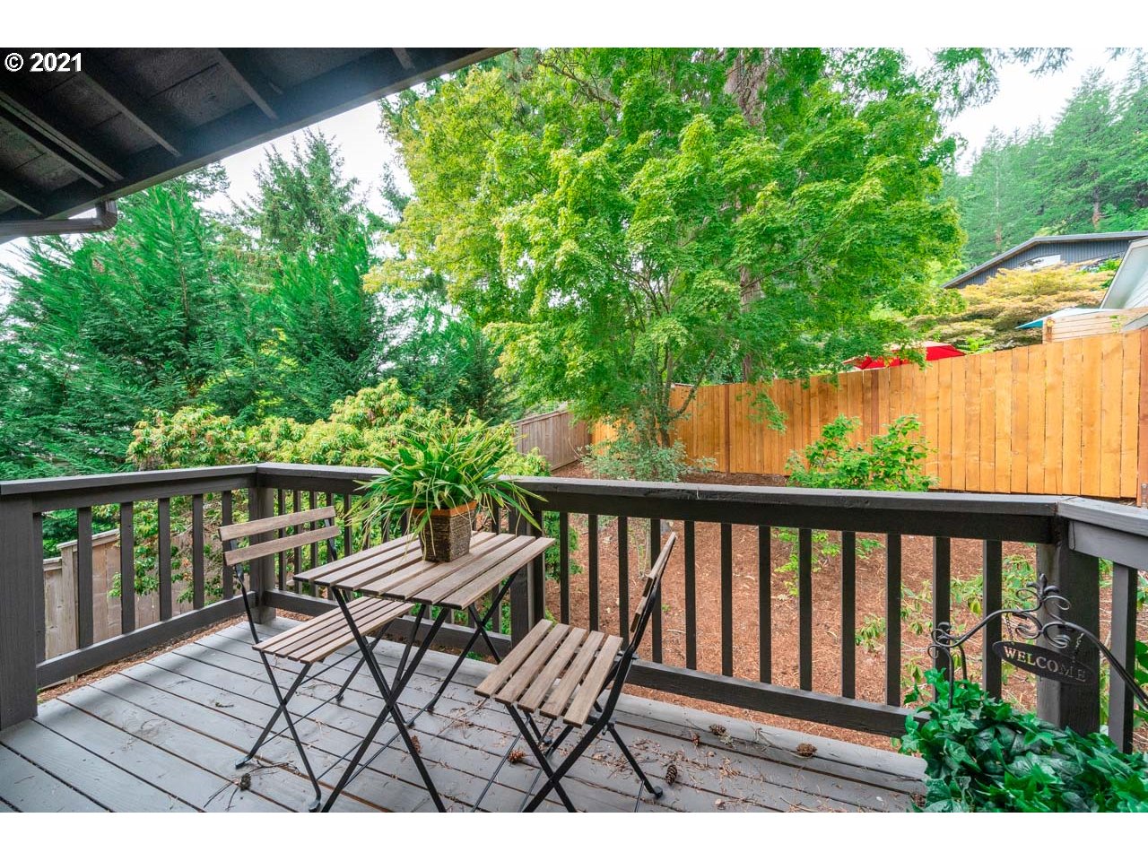3939 Southwest Altadena Avenue Portland, OR 97239 - Photo 22 of 31 a view of a chair in wooden deck