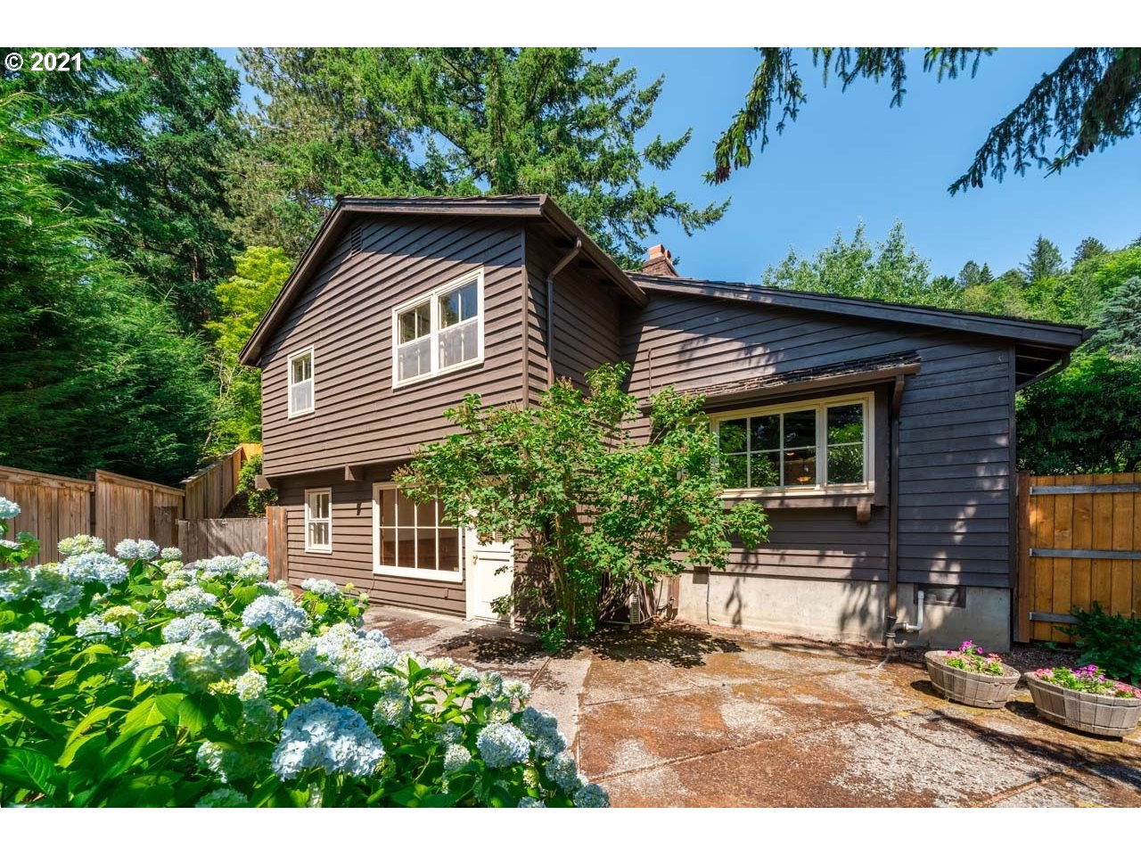 3939 Southwest Altadena Avenue Portland, OR 97239 - Photo 24 of 31 a front view of a house with a yard