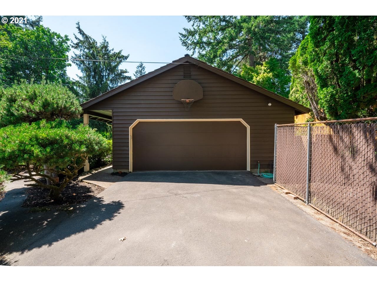 3939 Southwest Altadena Avenue Portland, OR 97239 - Photo 29 of 31 a front view of a house with a yard