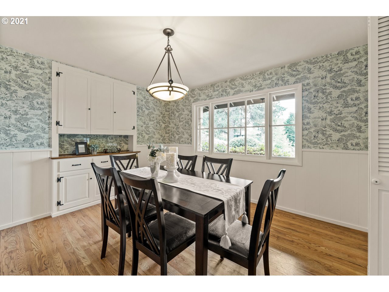 3939 Southwest Altadena Avenue Portland, OR 97239 - Photo 4 of 31 a view of a dining room with furniture and wooden floor