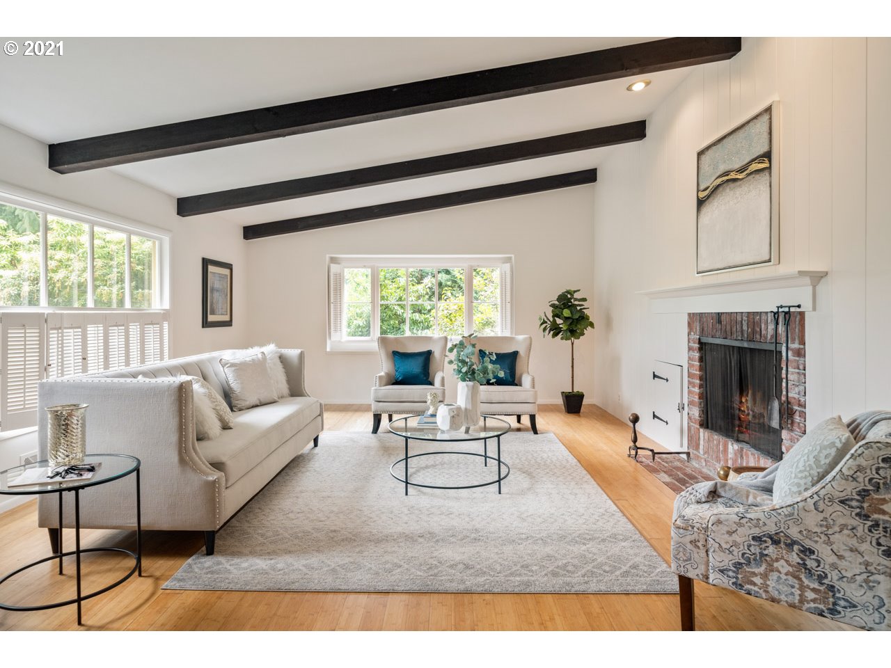 3939 Southwest Altadena Avenue Portland, OR 97239 - Photo 5 of 31 a living room with furniture a fireplace and a table