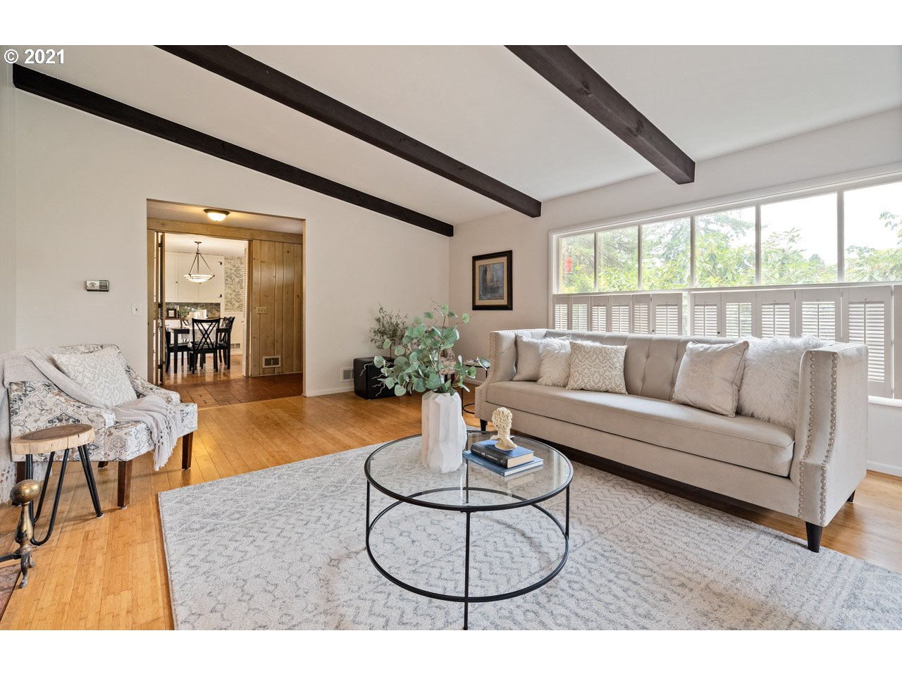 3939 Southwest Altadena Avenue Portland, OR 97239 - Photo 6 of 31 a living room with furniture and a wooden floor