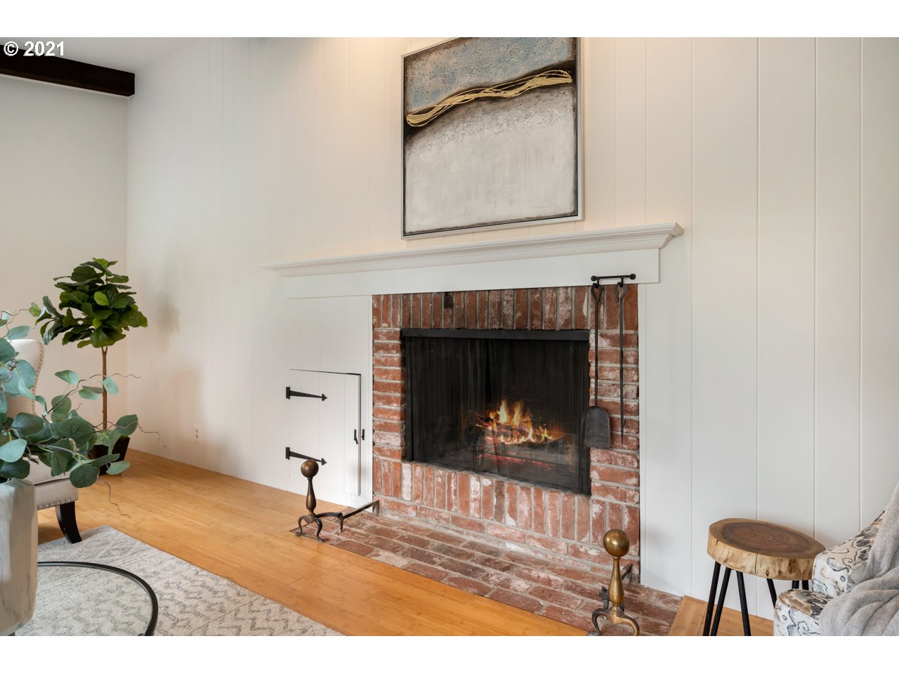 3939 Southwest Altadena Avenue Portland, OR 97239 - Photo 7 of 31 a living room with a fireplace and potted plant