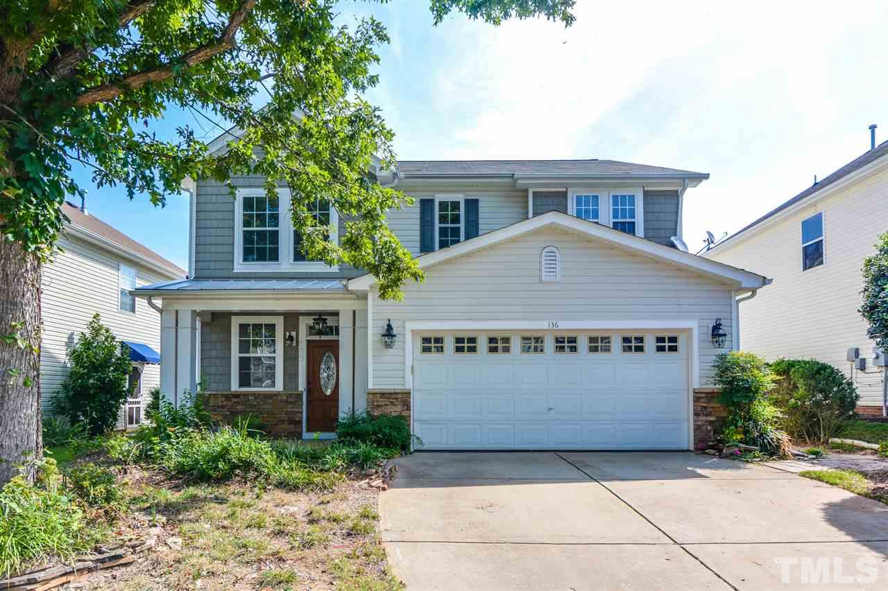 136 Ryder Cup Circle Raleigh, NC 27603 - Photo 1 of 17 a front view of a house with a garden