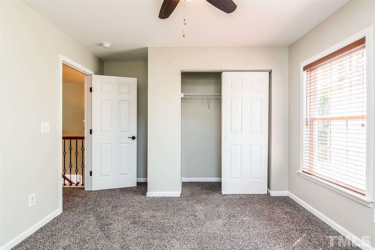 136 Ryder Cup Circle Raleigh, NC 27603 - Photo 13 of 17 a view of an empty room with a window