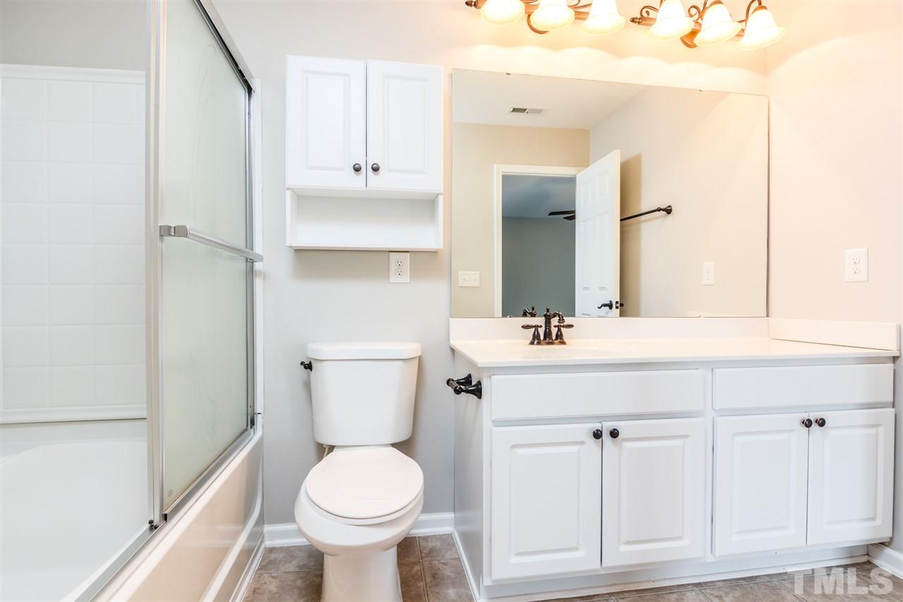 136 Ryder Cup Circle Raleigh, NC 27603 - Photo 10 of 17 a bathroom with a sink toilet and shower