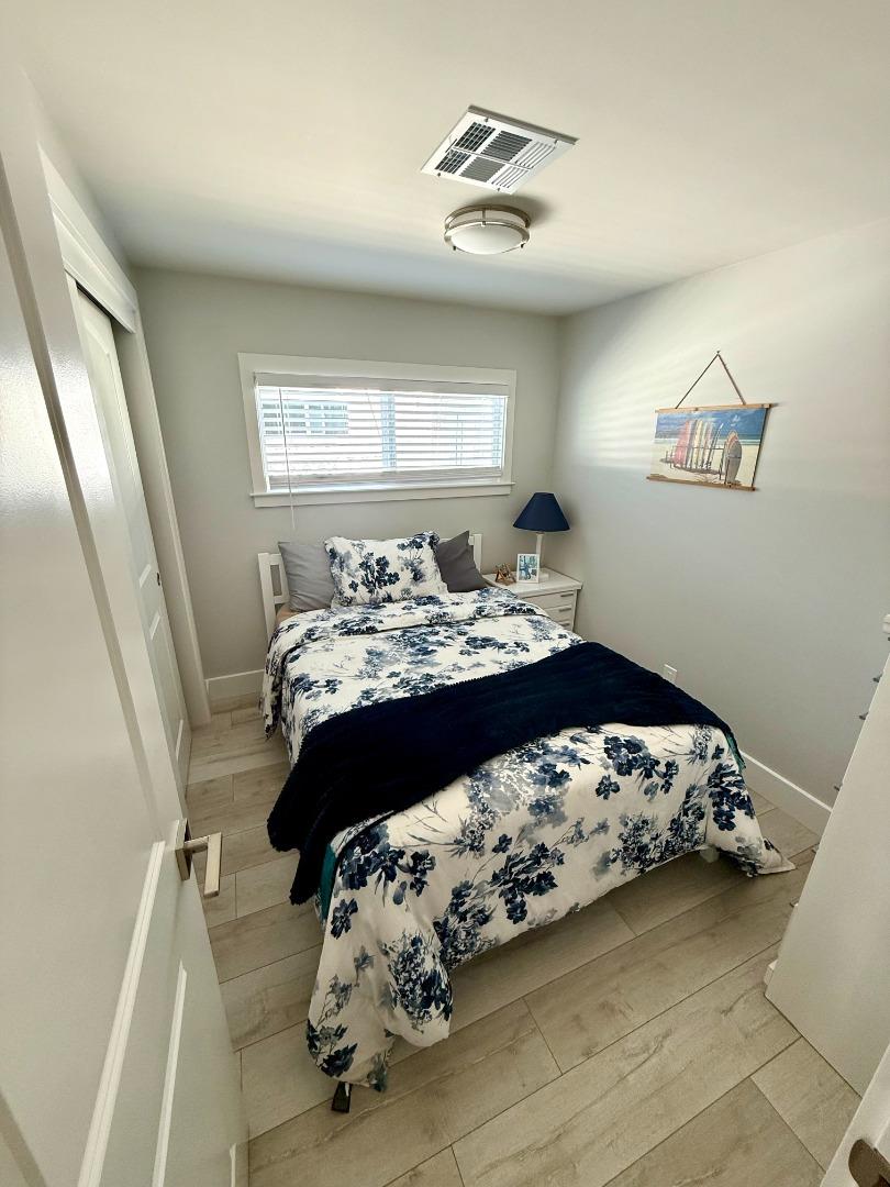 8 Lighthouse Road, Unit 8 Half Moon Bay, CA 94019 - Photo 6 of 21 a bed sitting in a bedroom next to a window