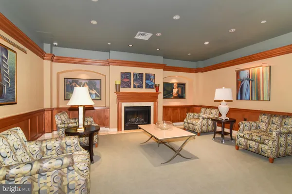a media room with lots of chairs and a projector screen
