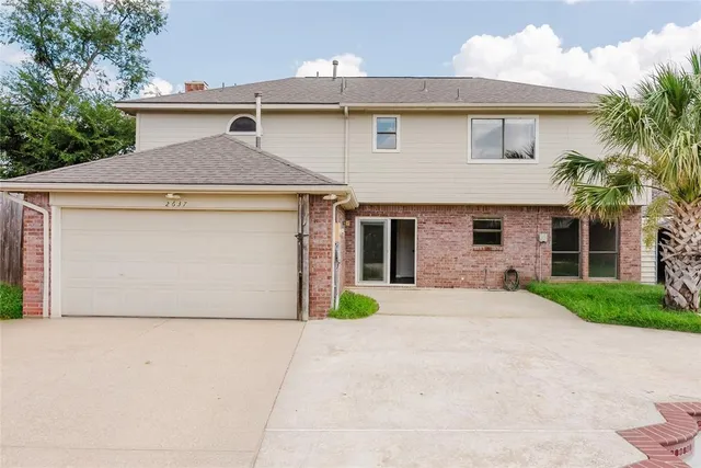 a front view of a house with garage