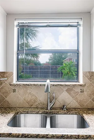 a view of a sink and a window