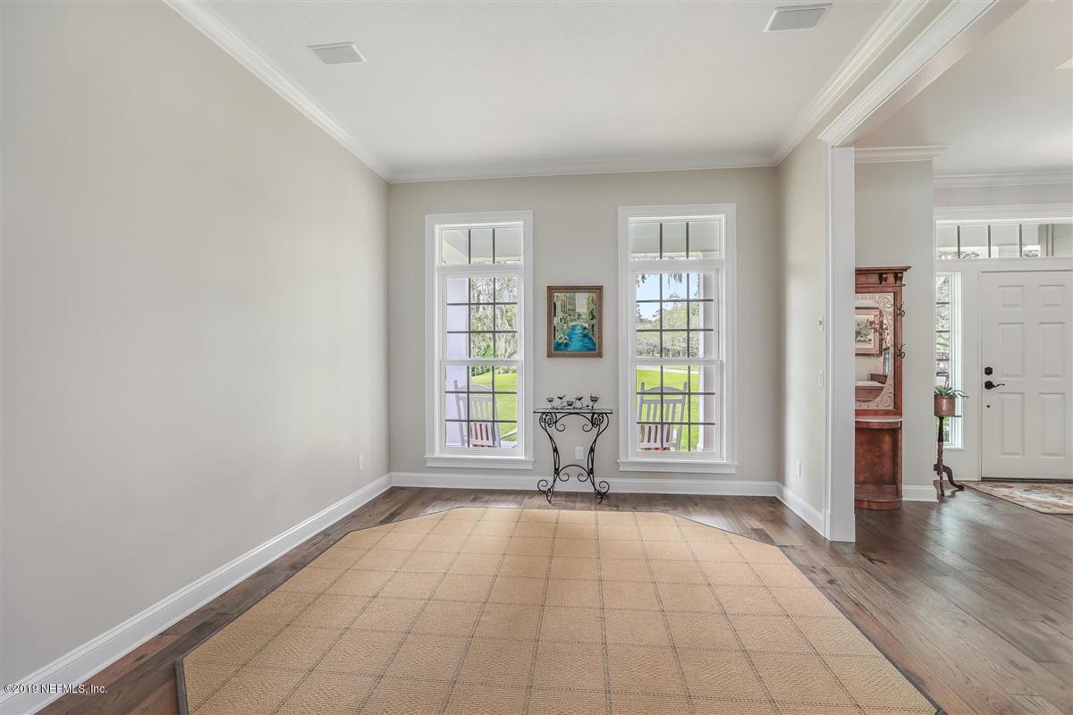 13056 Mandarin Road Jacksonville, FL 32223 - Photo 16 of 45 wooden floor in an empty room with a window