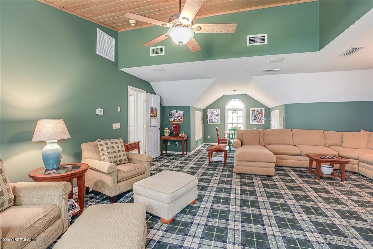 13056 Mandarin Road Jacksonville, FL 32223 - Photo 24 of 45 a living room with furniture and a mirror