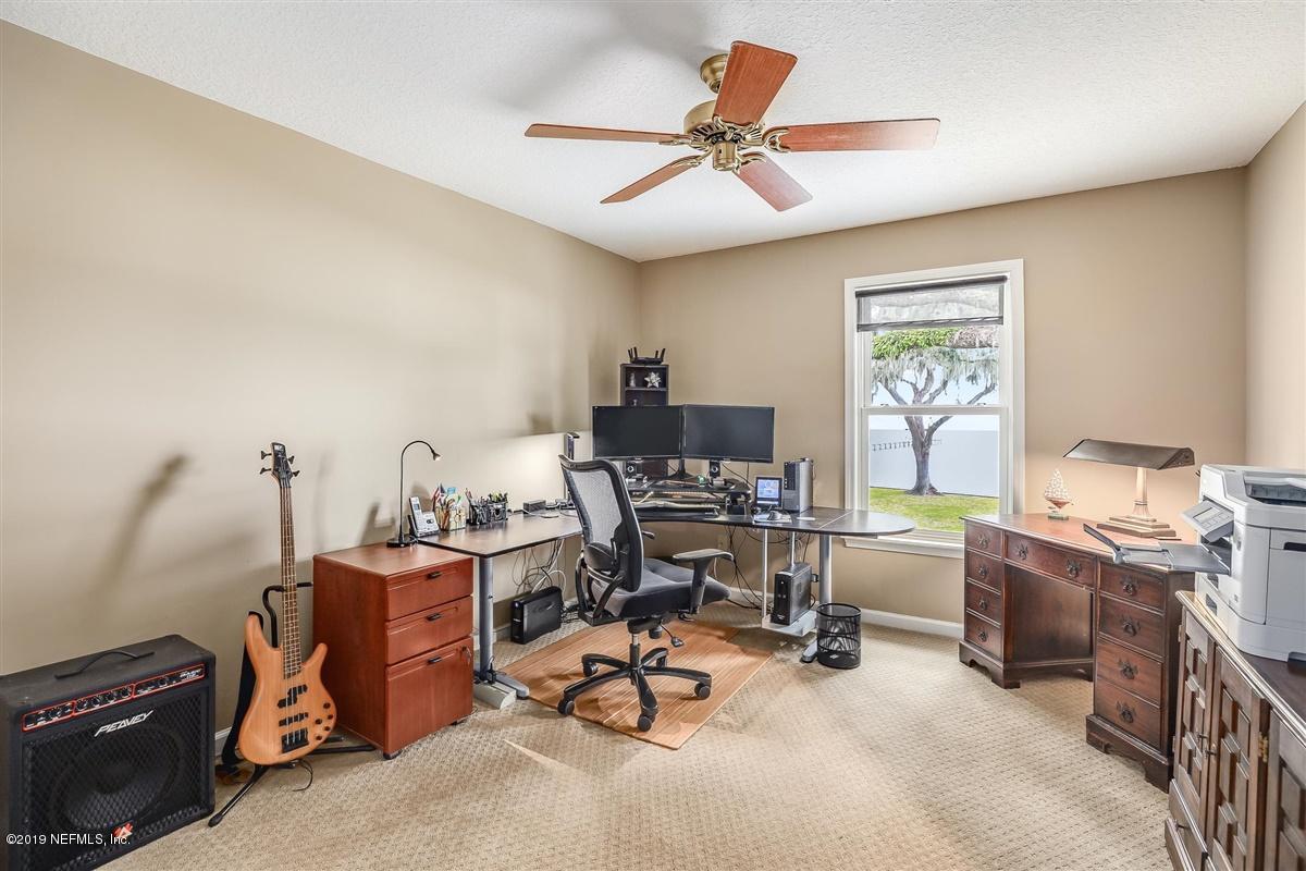 13056 Mandarin Road Jacksonville, FL 32223 - Photo 28 of 45 a view of a workspace with furniture and a window