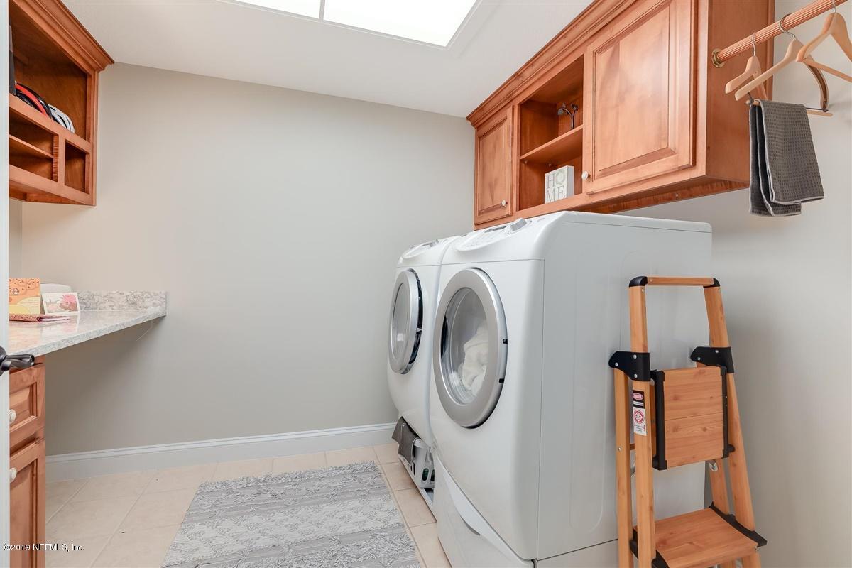 13056 Mandarin Road Jacksonville, FL 32223 - Photo 30 of 45 a utility room with dryer and washer