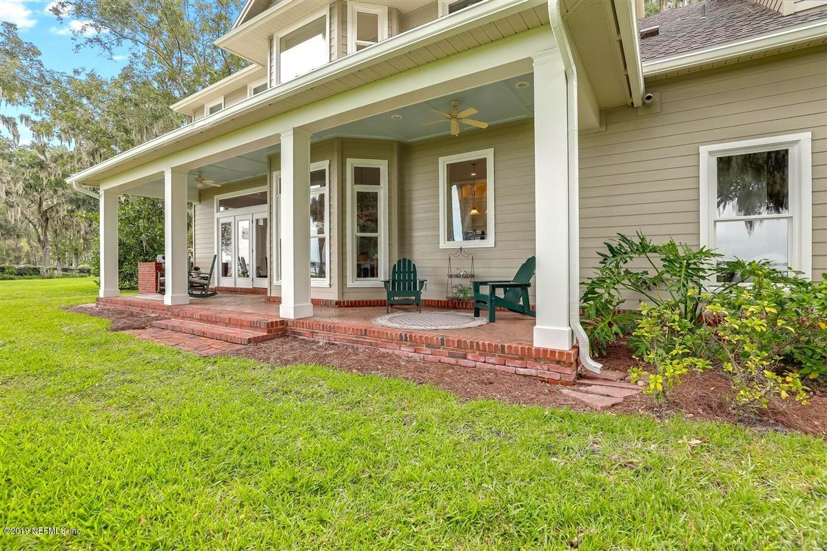 13056 Mandarin Road Jacksonville, FL 32223 - Photo 31 of 45 a view of a house with backyard and porch