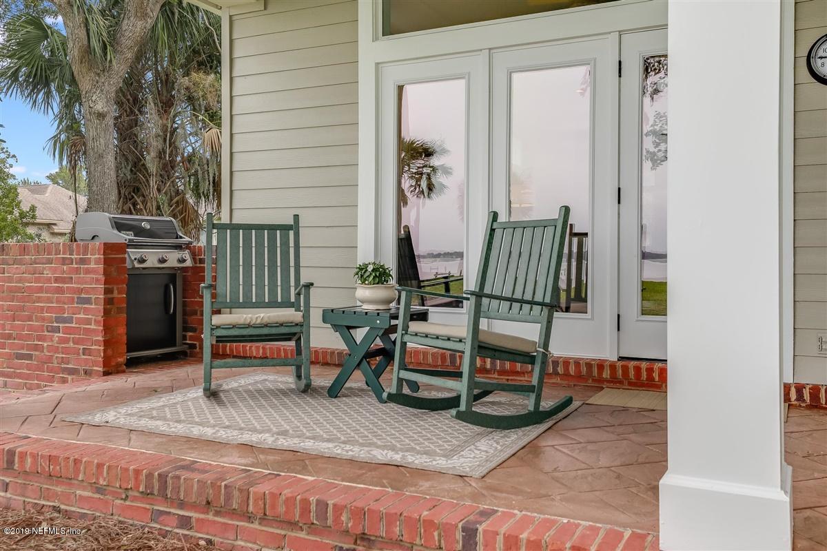 13056 Mandarin Road Jacksonville, FL 32223 - Photo 32 of 45 a bench sitting in front of a building