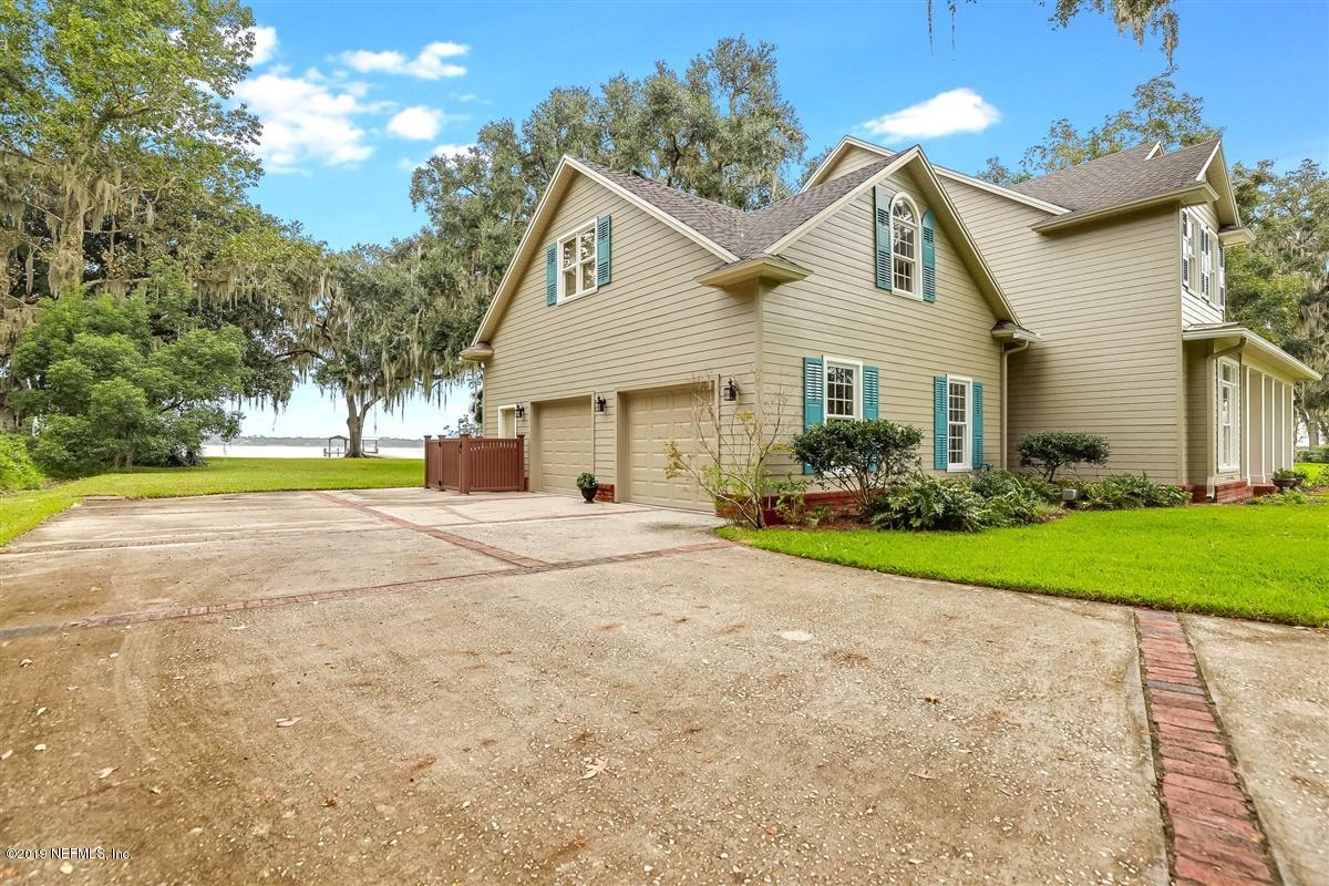 13056 Mandarin Road Jacksonville, FL 32223 - Photo 33 of 45 a view of a house with a yard and pathway