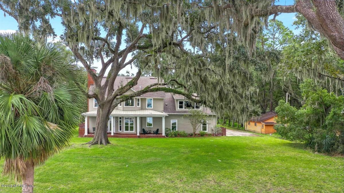 13056 Mandarin Road Jacksonville, FL 32223 - Photo 34 of 45 a front view of a house with a garden