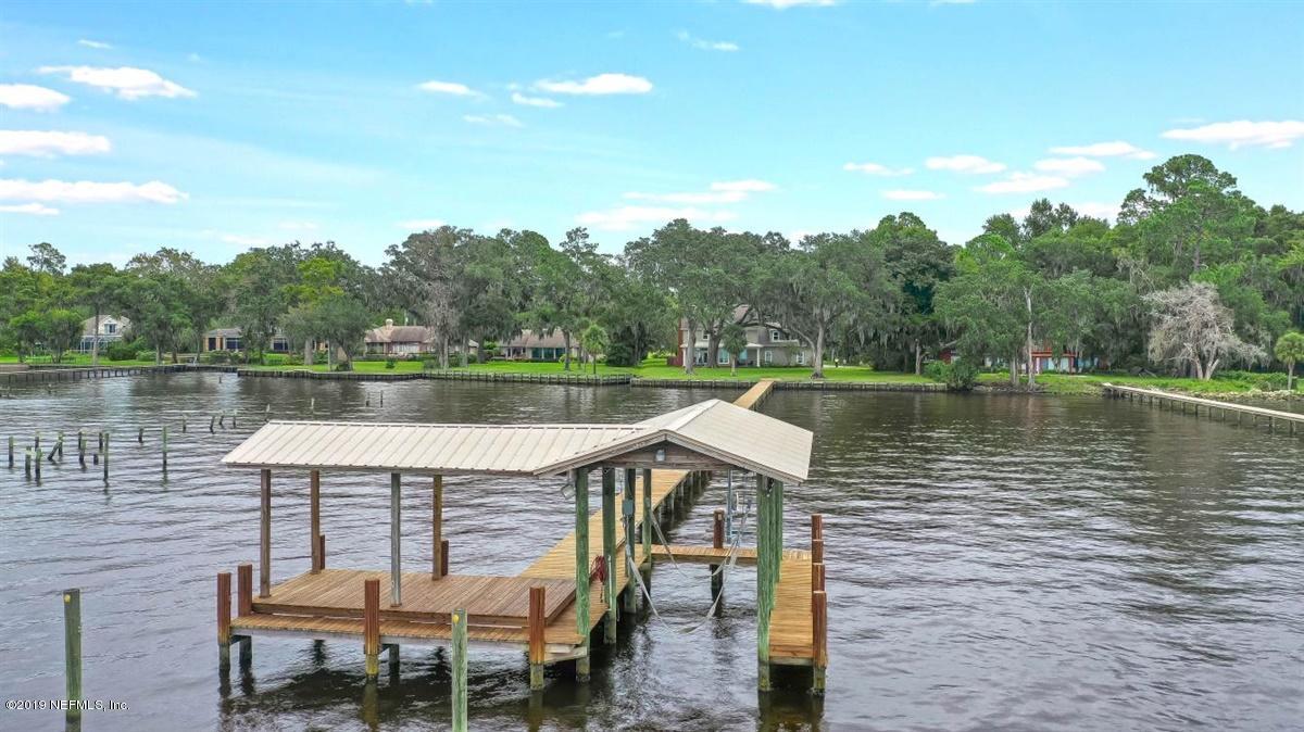 13056 Mandarin Road Jacksonville, FL 32223 - Photo 39 of 45 a view of a lake with table and chairs