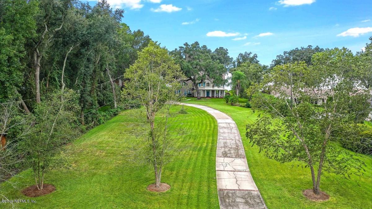 13056 Mandarin Road Jacksonville, FL 32223 - Photo 41 of 45 a view of a pathway both side of yard