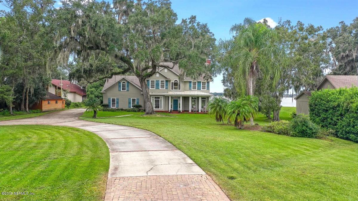 13056 Mandarin Road Jacksonville, FL 32223 - Photo 44 of 45 a front view of house with yard and green space