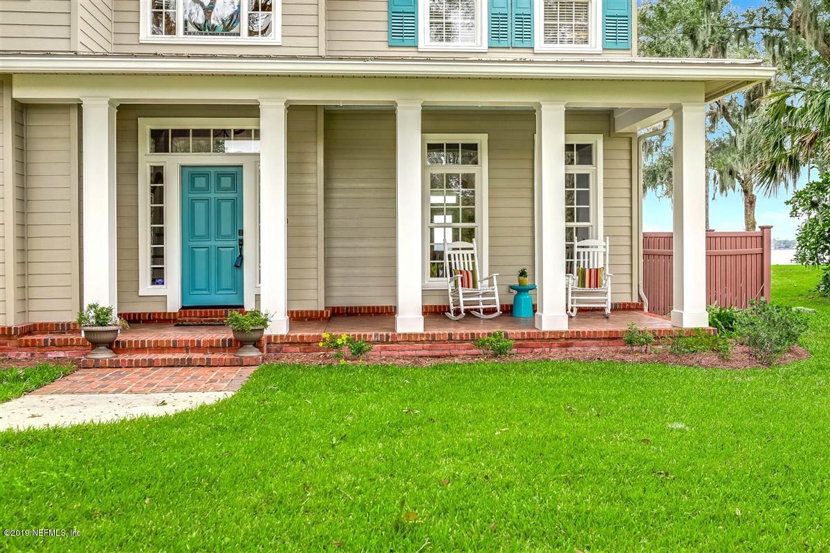 13056 Mandarin Road Jacksonville, FL 32223 - Photo 5 of 45 front view of a house with a yard and sitting area