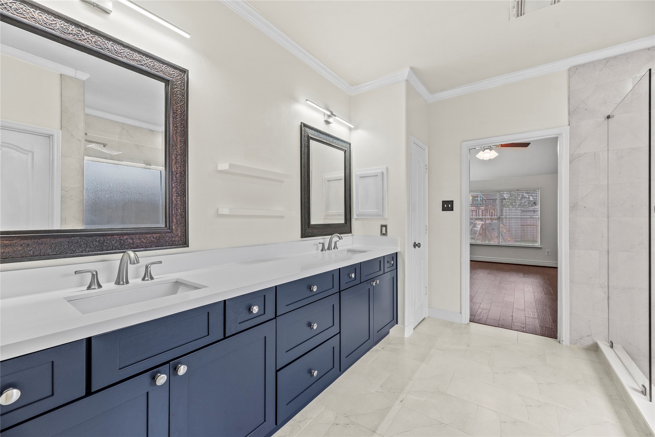 402 Spring Trace Court Houston, TX 77094 - Photo 18 of 35 a spacious bathroom with a double vanity sink double and mirror