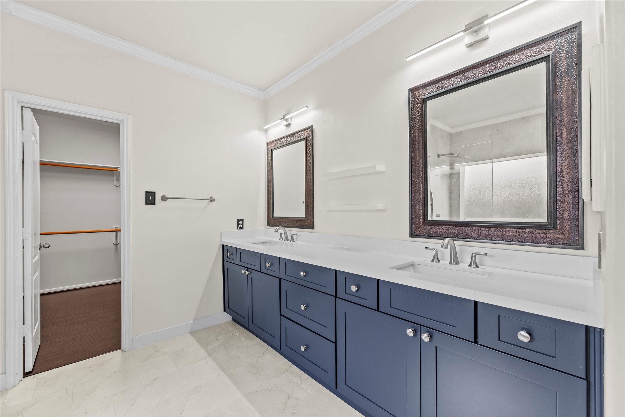 402 Spring Trace Court Houston, TX 77094 - Photo 20 of 35 a bathroom with a double vanity sink and mirror