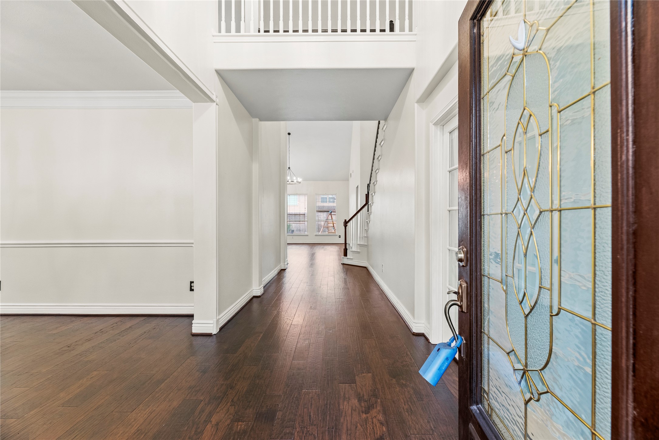 402 Spring Trace Court Houston, TX 77094 - Photo 2 of 35 a view of a hallway with wooden floor and staircase