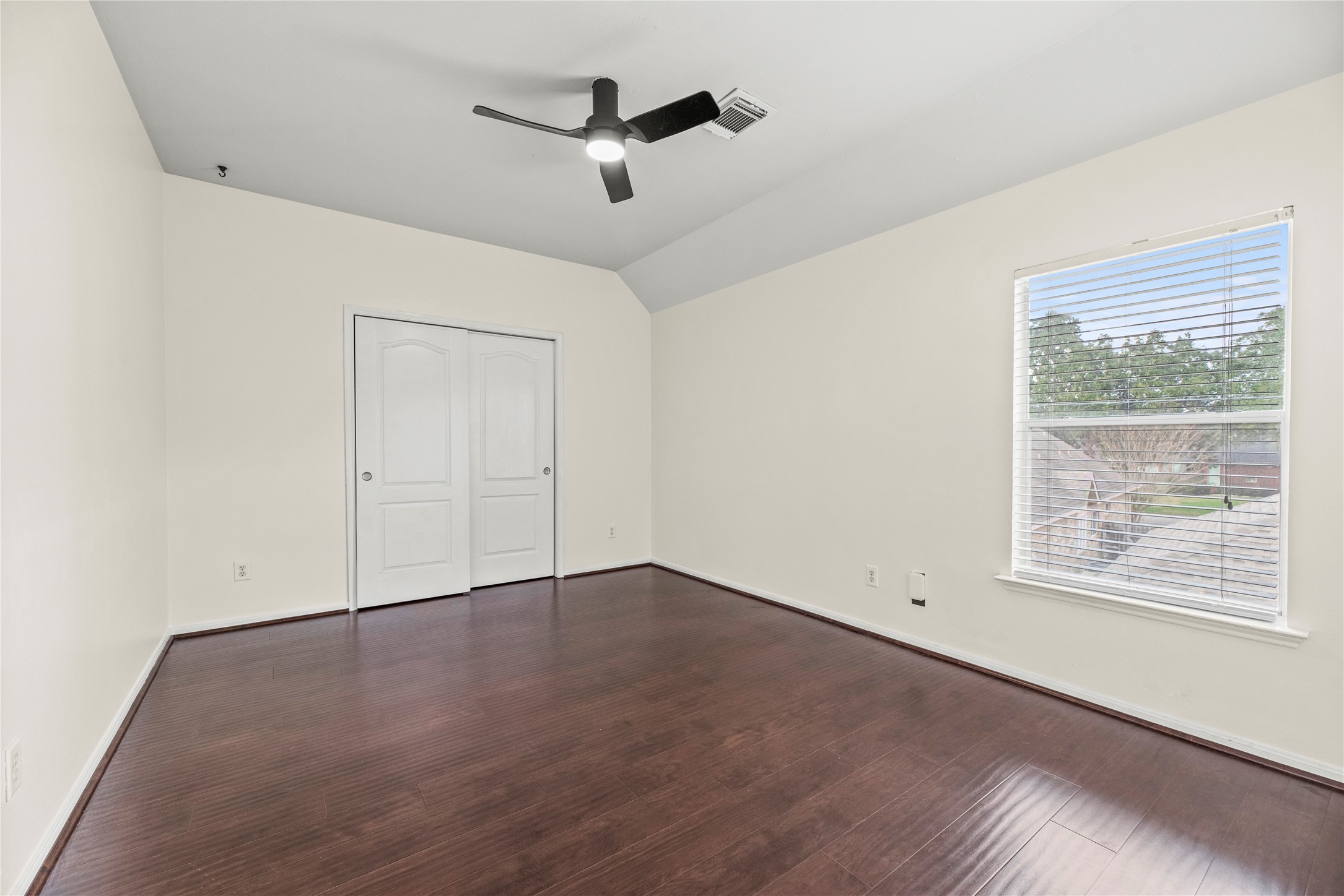 402 Spring Trace Court Houston, TX 77094 - Photo 23 of 35 an empty room with ceiling fan and windows