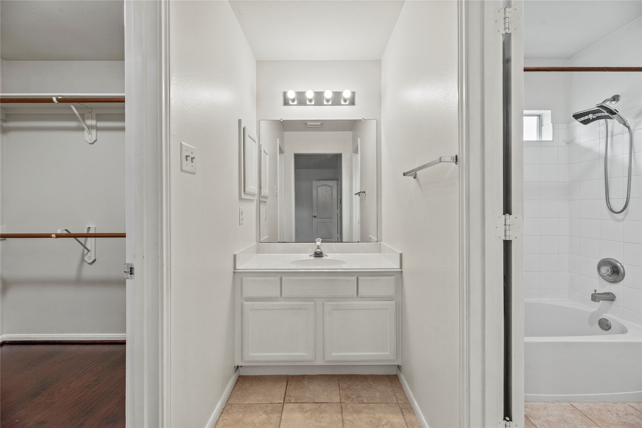 402 Spring Trace Court Houston, TX 77094 - Photo 24 of 35 a bathroom with a bathtub sink vanity and mirror