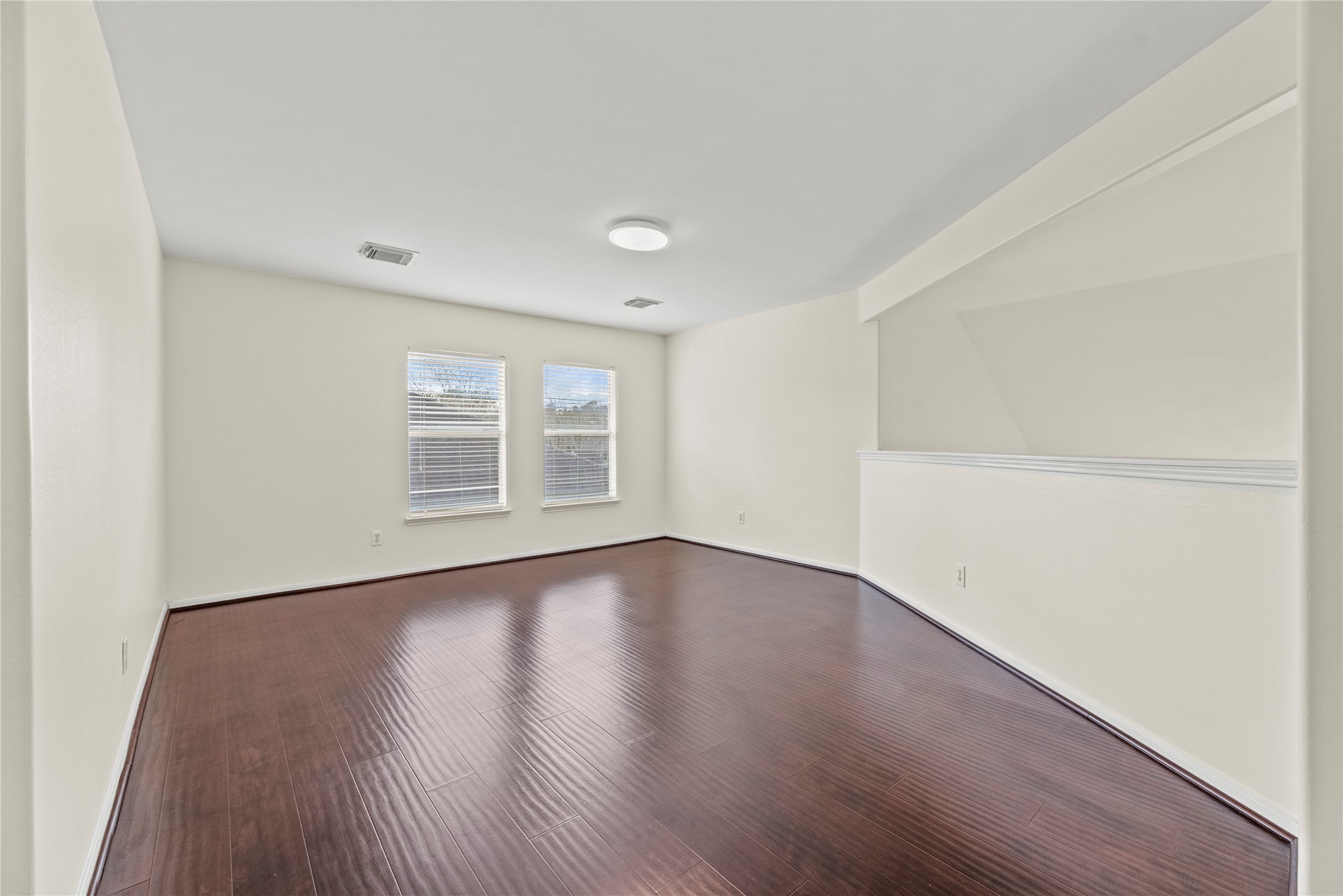 402 Spring Trace Court Houston, TX 77094 - Photo 28 of 35 an empty room with wooden floor and windows