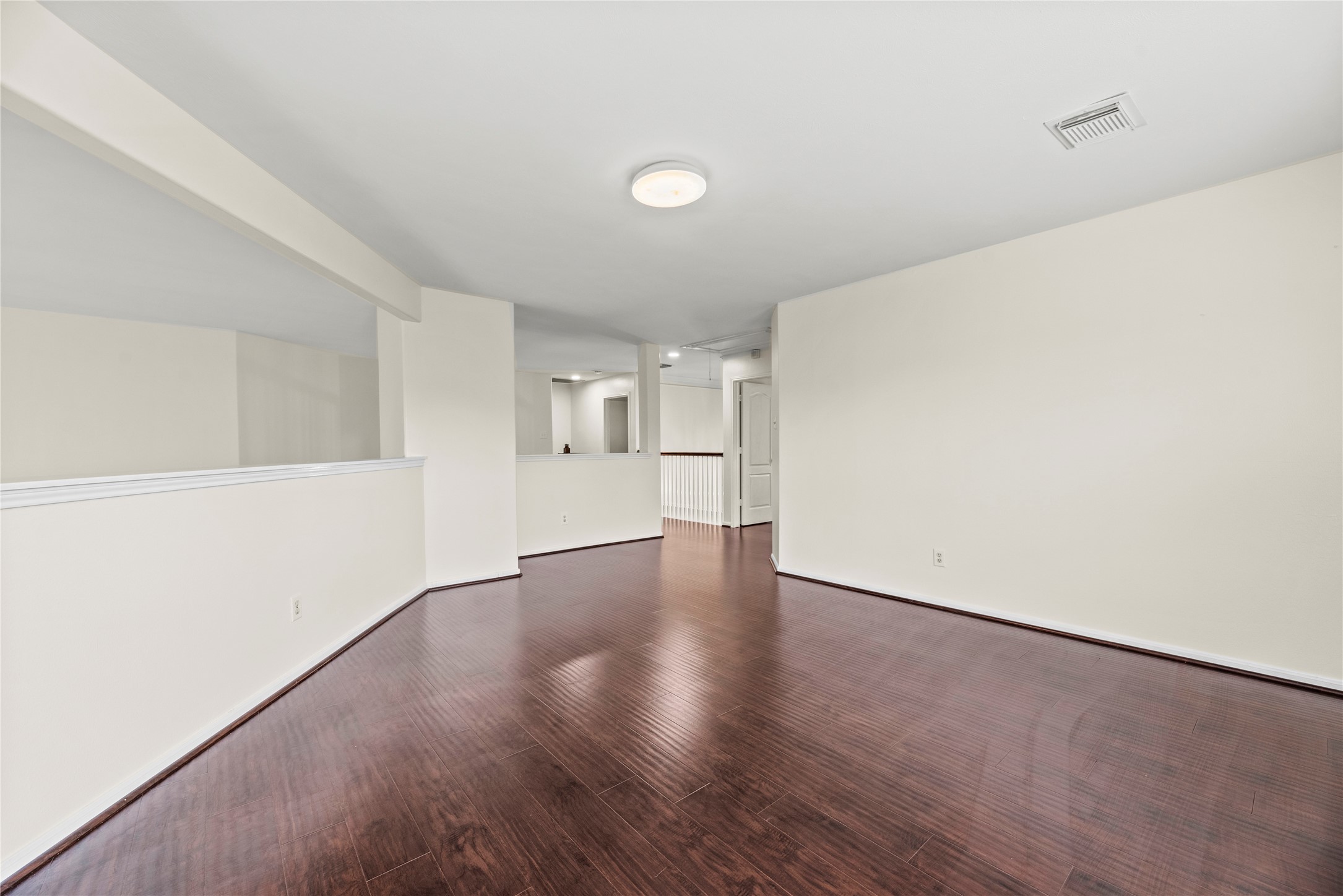 402 Spring Trace Court Houston, TX 77094 - Photo 29 of 35 a view of empty room with wooden floor