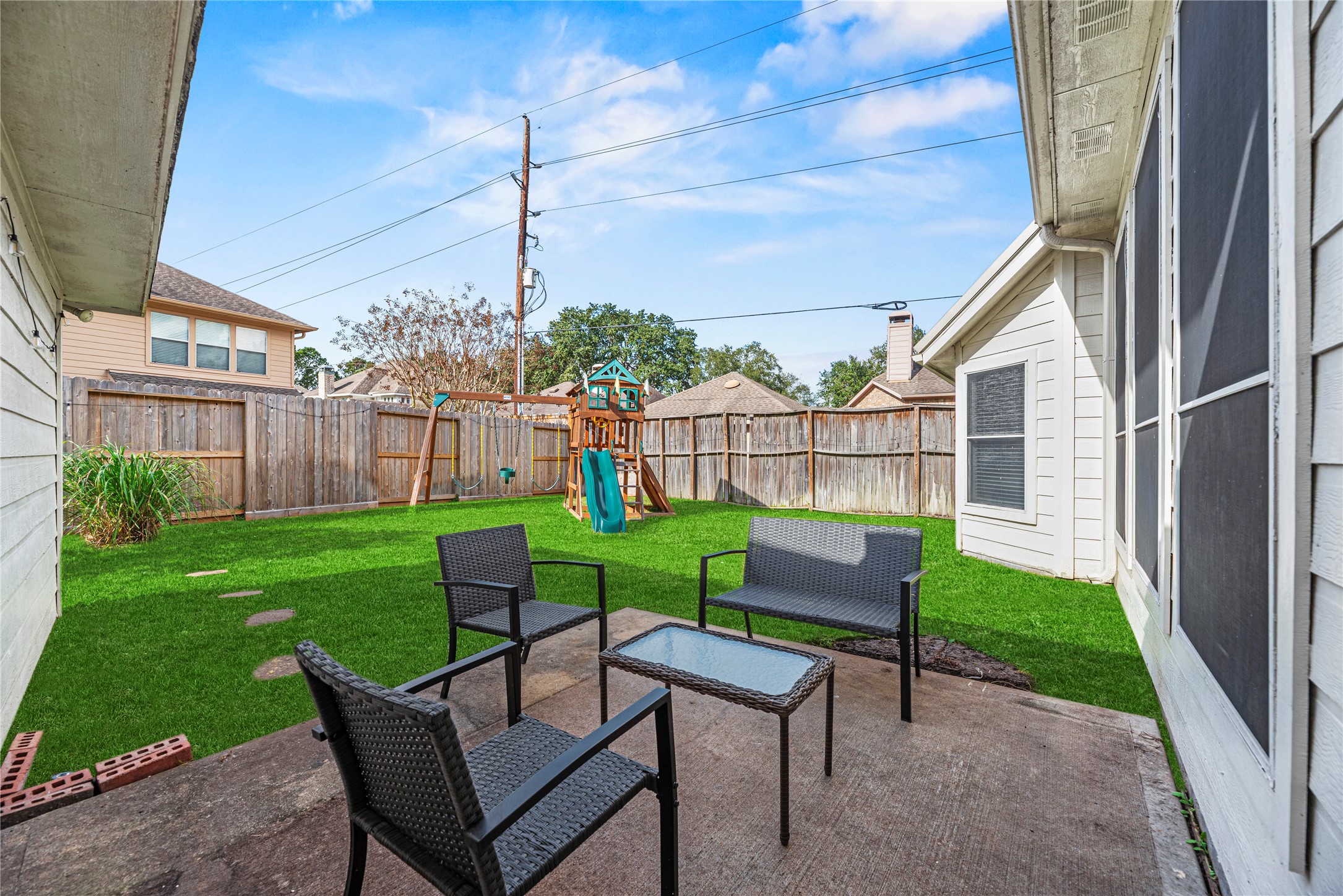 402 Spring Trace Court Houston, TX 77094 - Photo 33 of 35 a view of a chairs and table in backyard of the house
