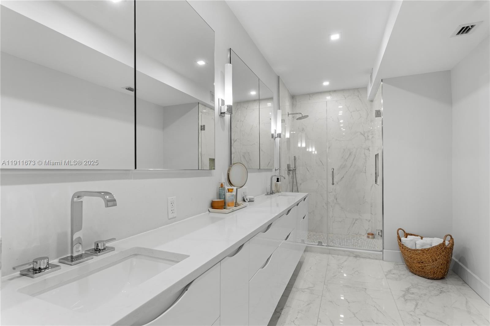 5001 Collins Avenue, Unit PH1 Miami Beach, FL 33140 - Photo 25 of 82 a bathroom with a double vanity sink mirror and double