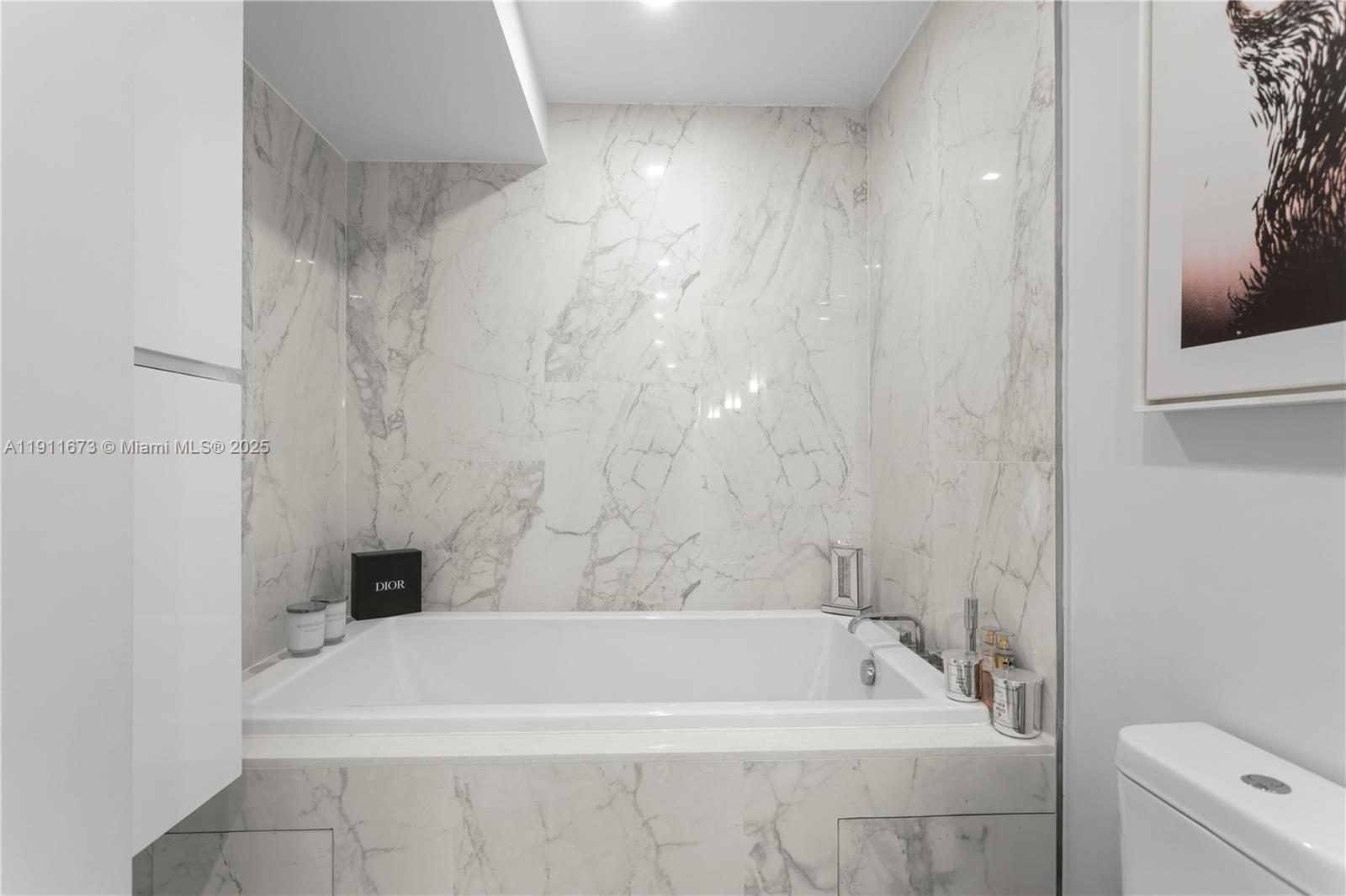 5001 Collins Avenue, Unit PH1 Miami Beach, FL 33140 - Photo 27 of 82 a bathroom with a bathtub and a toilet