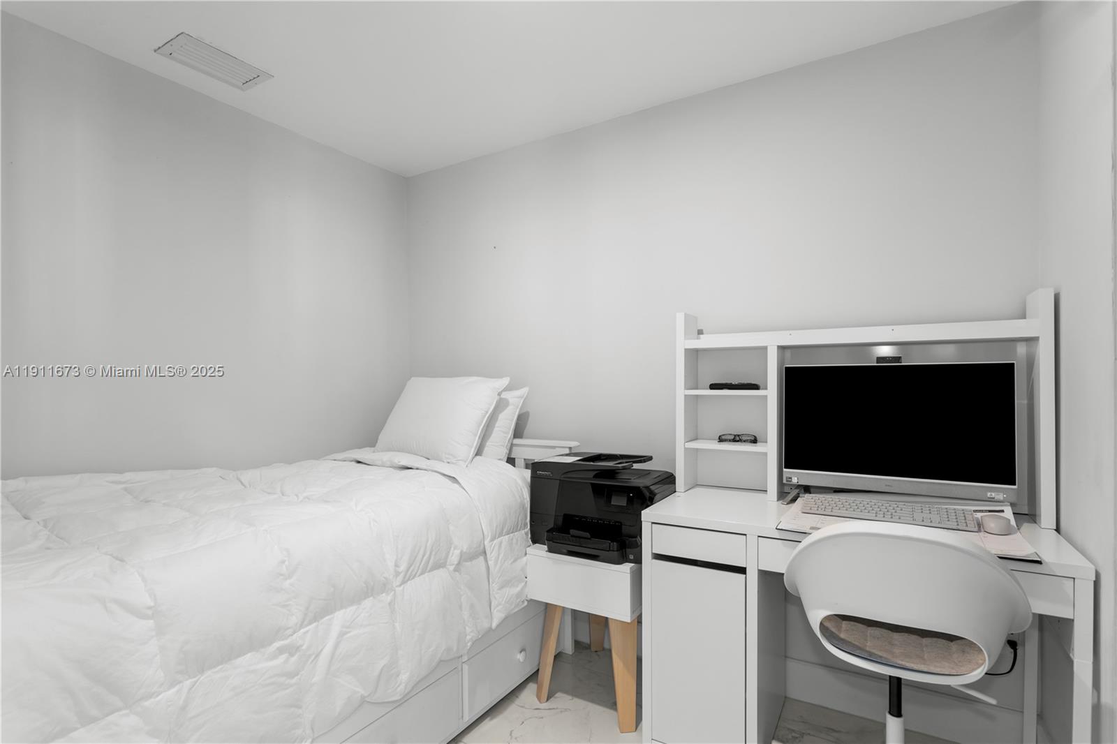 5001 Collins Avenue, Unit PH1 Miami Beach, FL 33140 - Photo 37 of 82 a bedroom with a bed and a flat screen tv