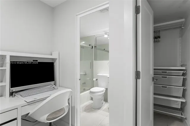 a view of a lake in middle of forest