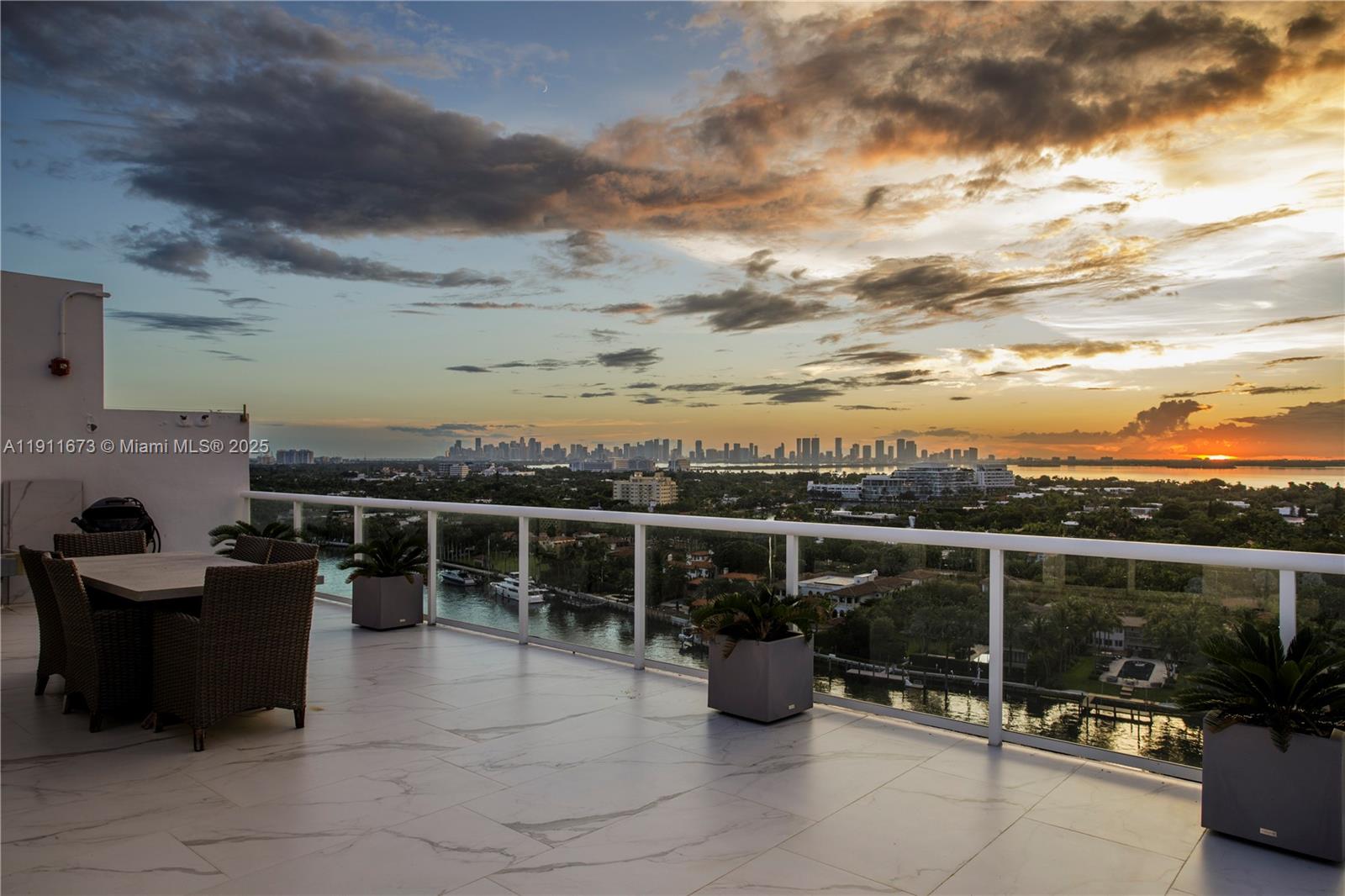 5001 Collins Avenue, Unit PH1 Miami Beach, FL 33140 - Photo 54 of 82 a view of a roof deck with couches and sky view